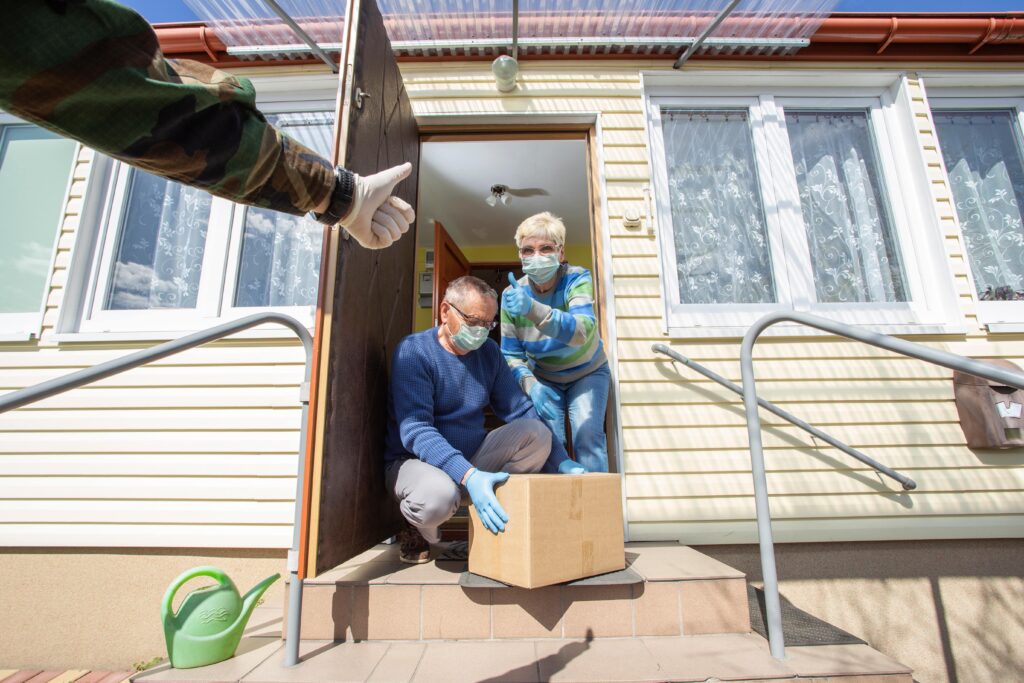 people delivering groceries with masks on